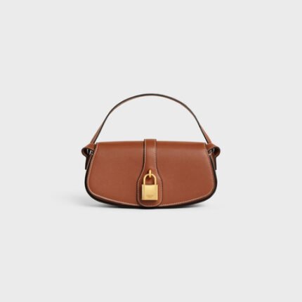 CLUTCH ON STRAP TABOU IN SMOOTH CALFSKIN TAN